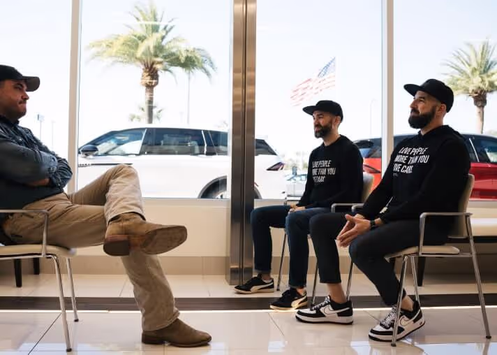 Kyle consulting with a dealer in their showroom